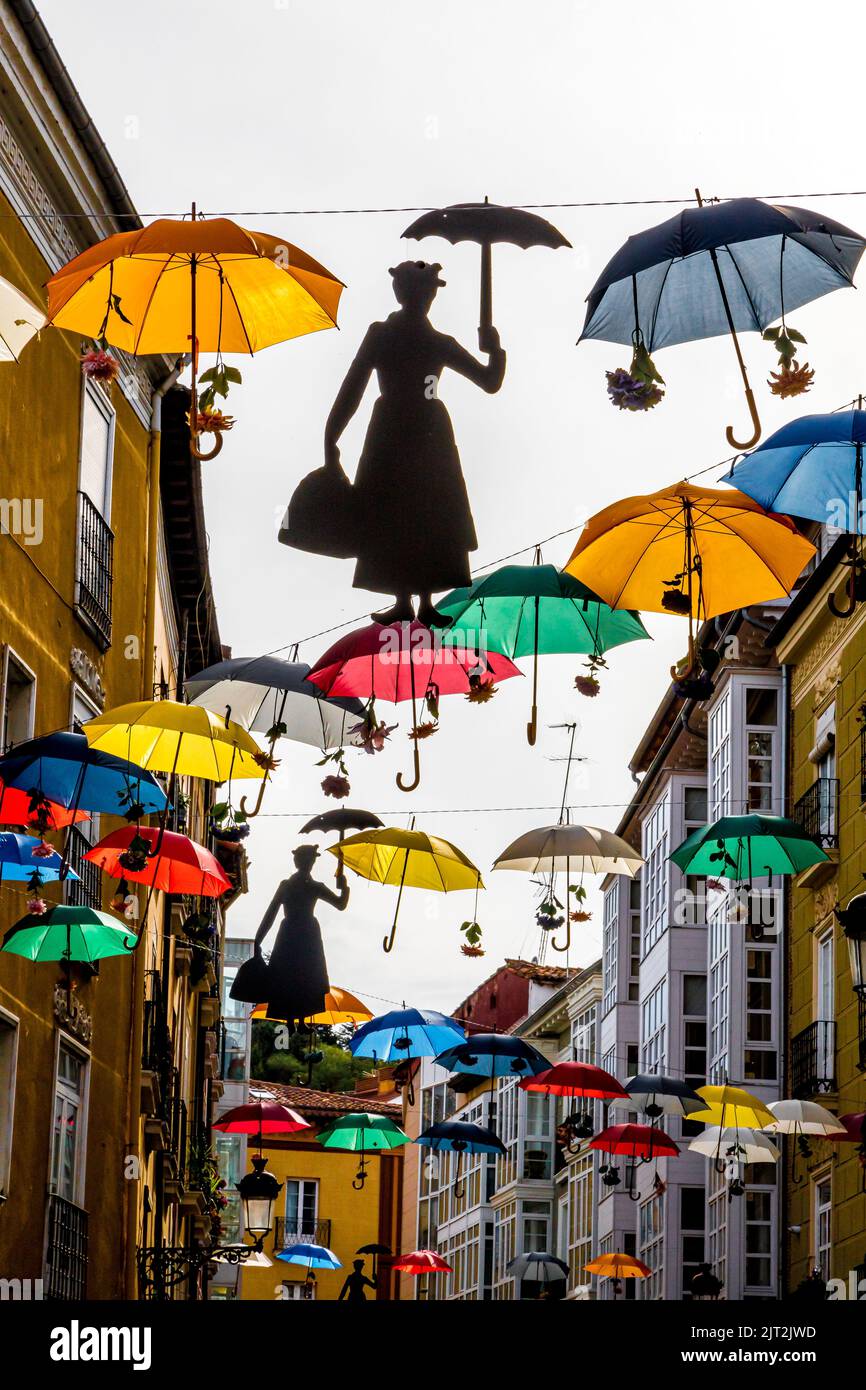 bright colored umbrellas above the street in Burgos Spain Stock Photo