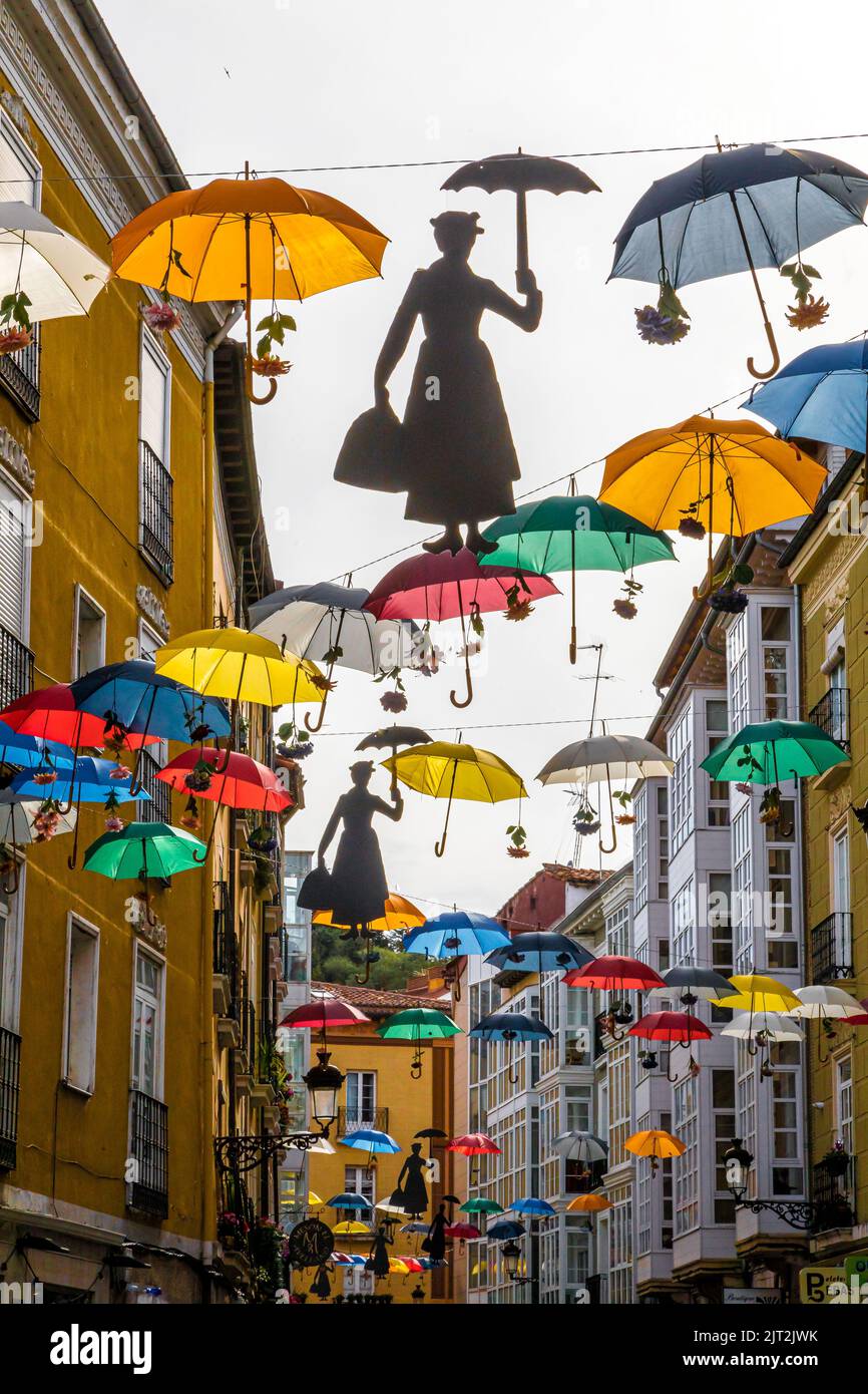 bright colored umbrellas above the street in Burgos Spain Stock Photo