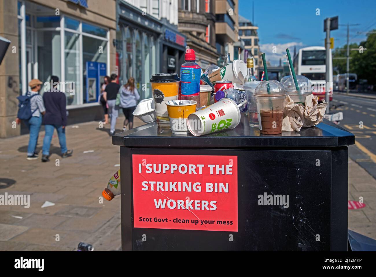 Discarded rubbish and sign of support on Princes Street due to industrial action by Edinburgh council workers. Stock Photo