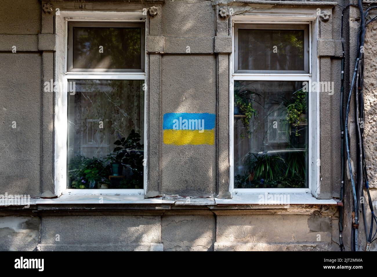 A blue and yellow flag Ukrainian national colours is painted on a