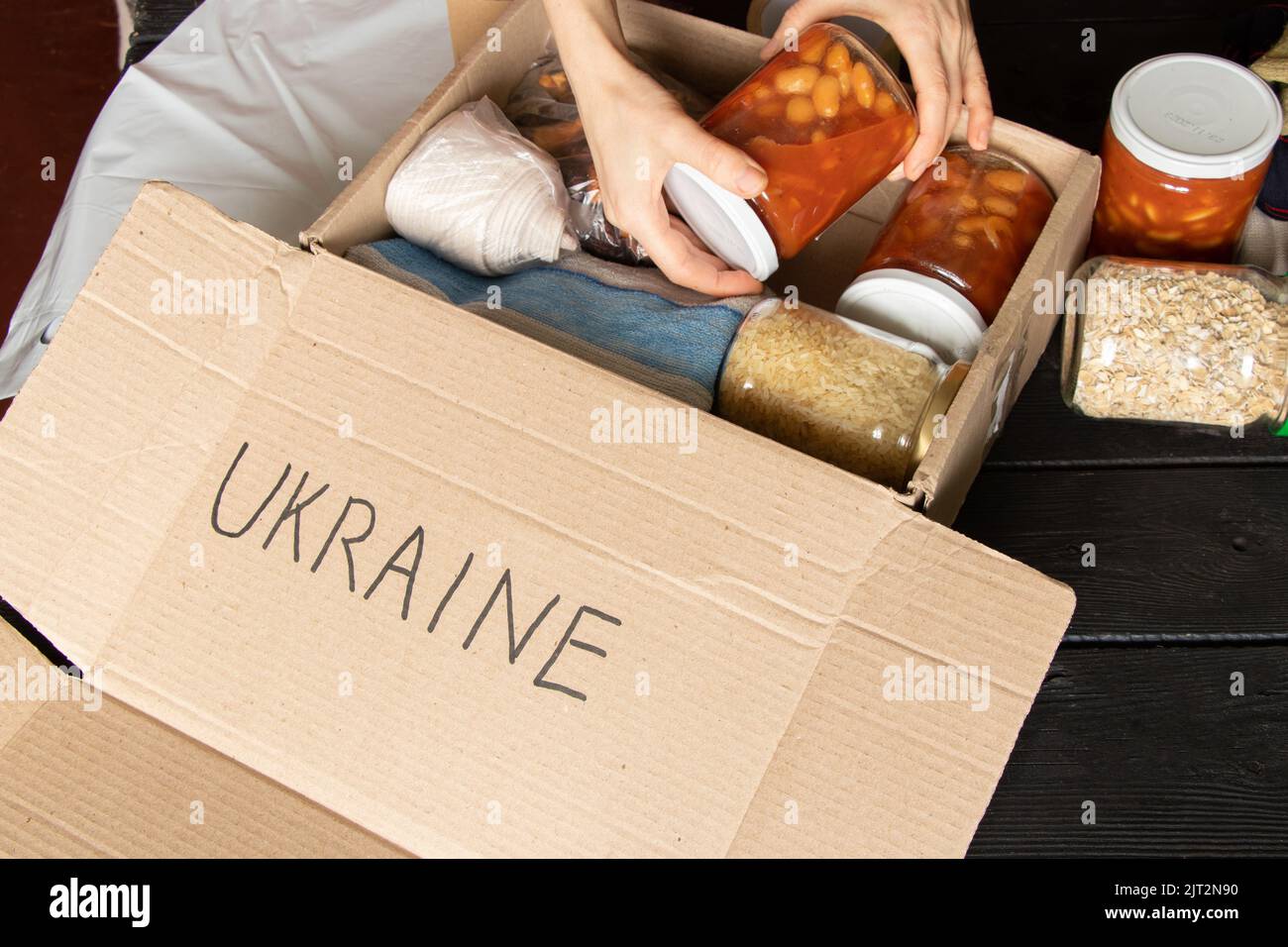 Collecting a humanitarian food set to help people who suffered during the war at the hands of Russia, stop the war in Ukraine, humanitarian aid 2022 Stock Photo