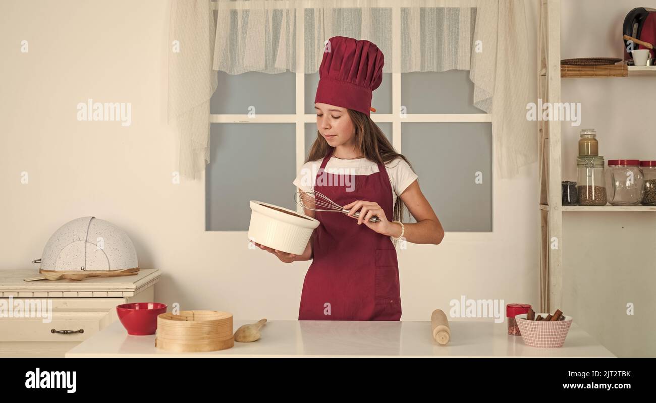 child beating with beater, kitchen utensil Stock Photo Alamy
