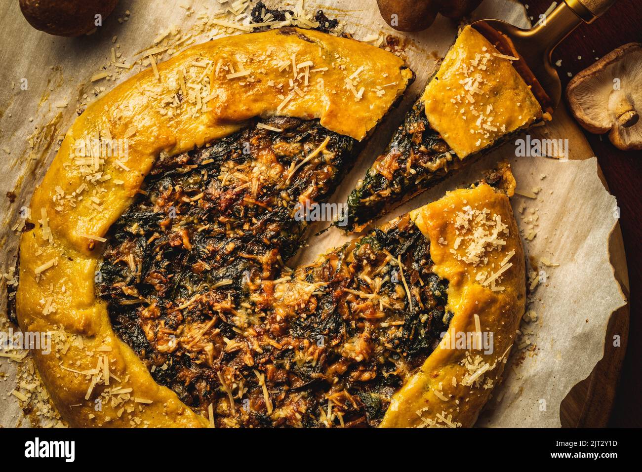 A top view of a spatula lifting up a triangular slice of delicious