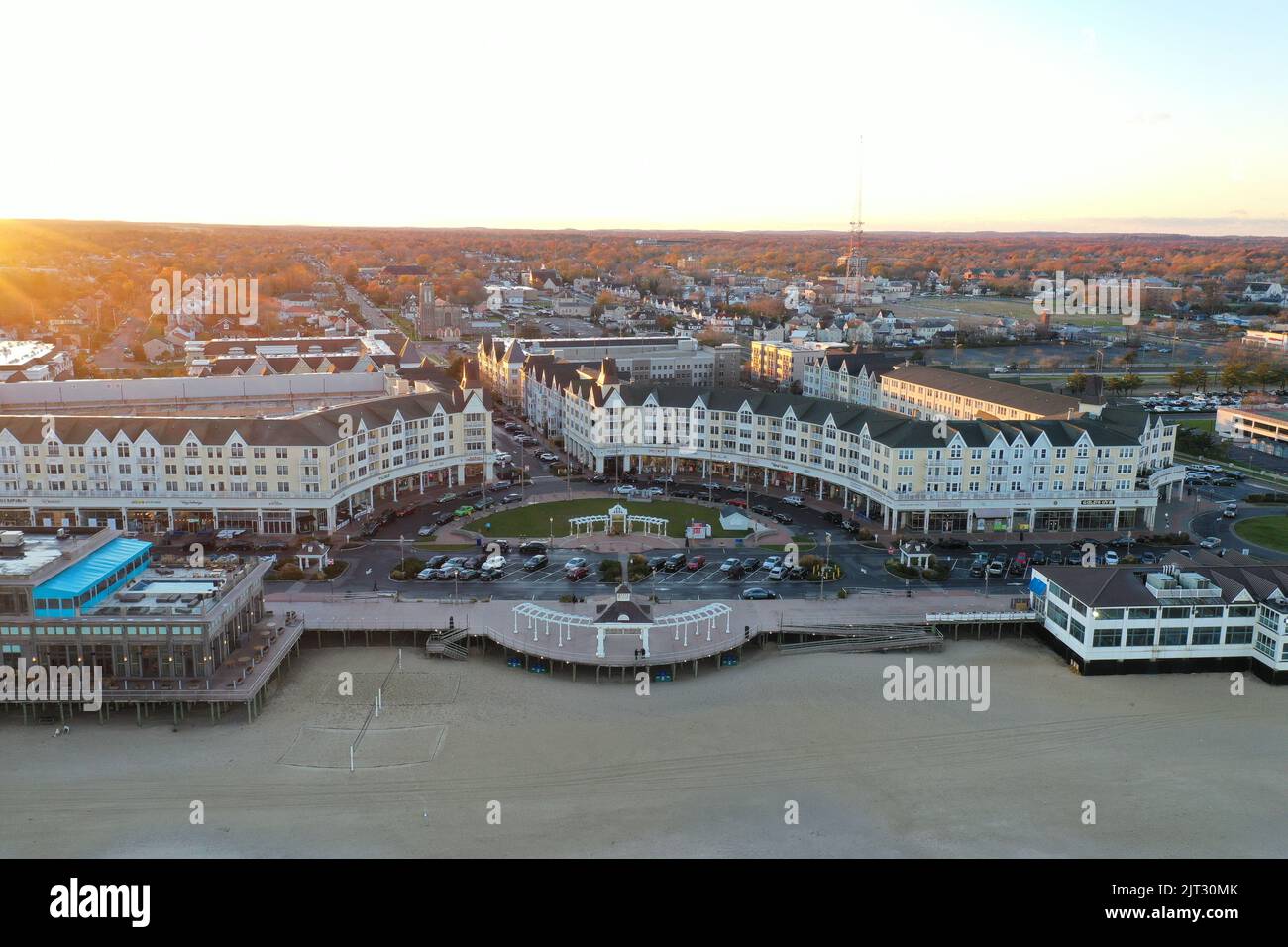 A drone shot of the Pier Village neighborhood on the coast of Long Branch, New Jersey, at sunset Stock Photo