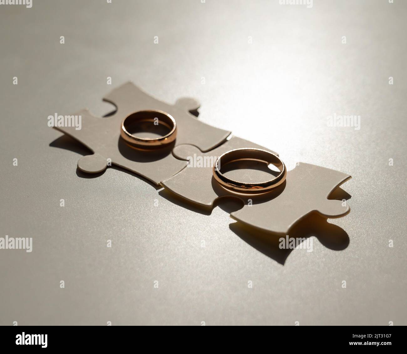 Wedding rings and puzzle pieces. Husband and wife complement each other