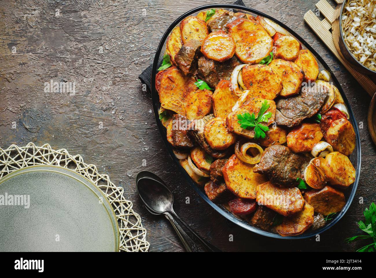 Arabic cuisine; Egyptian oriental dish "Baked potatoes with veal chunks" served with traditional