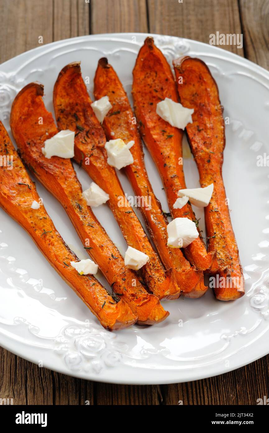 Roasted butternut squash with cheese vertical Stock Photo Alamy
