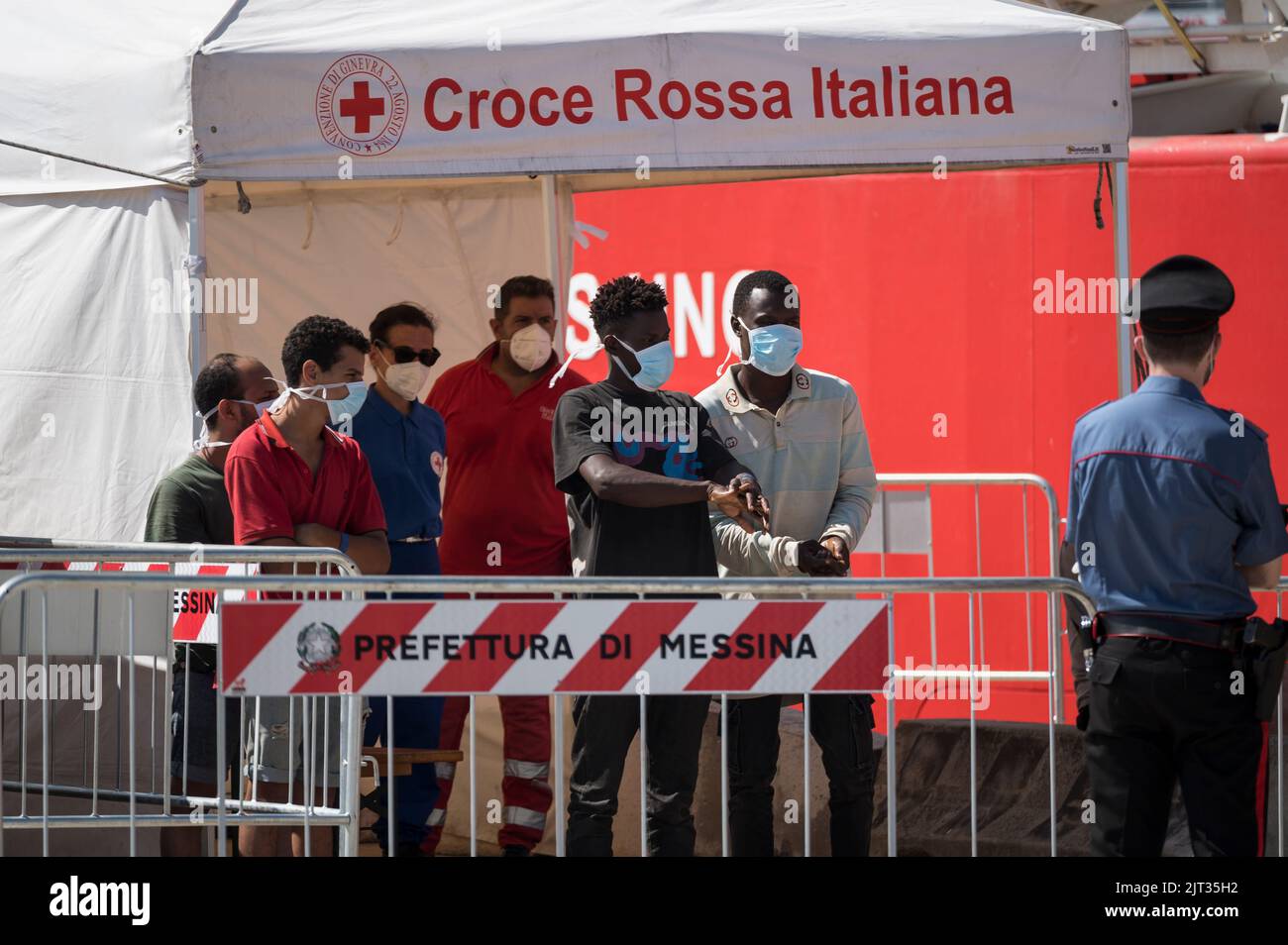 Messina, Italy. 27th Aug, 2022. Migrants seen disinfecting their hands