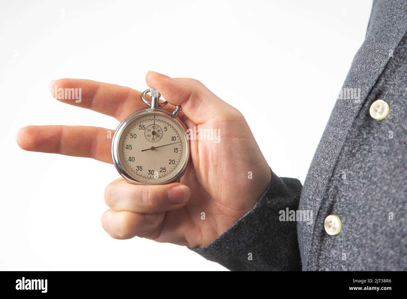hand with a mechanical stopwatch on a white background Stock Photo Alamy