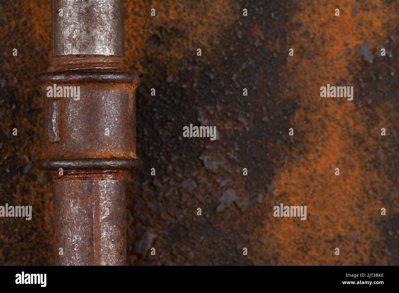 Old rusty valve pipes on rusty metal wall background Stock Photo - Alamy