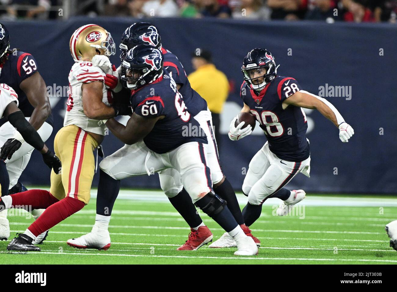 Houston Texans running back Rex Burkhead (28) turns the corner with a block by Houston Texans guard A.J. Cann (60) during the NFL game between the San Stock Photo