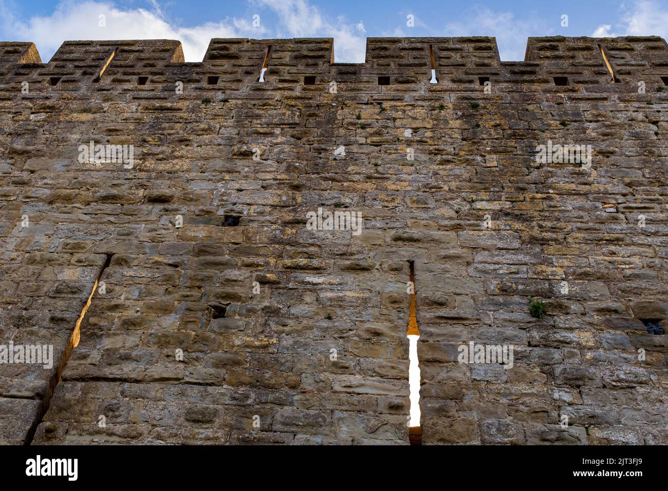 Arrow-slits of the Carcassonne city walls, taken in winter at the end of the afternoon, with no people Stock Photo