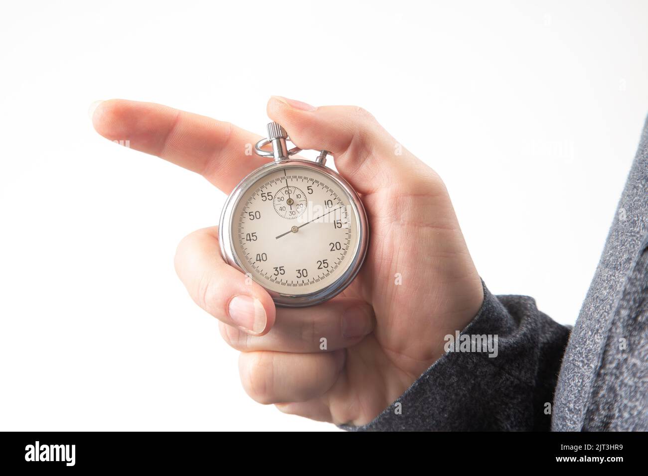 hand with a mechanical stopwatch on a white background Stock Photo Alamy