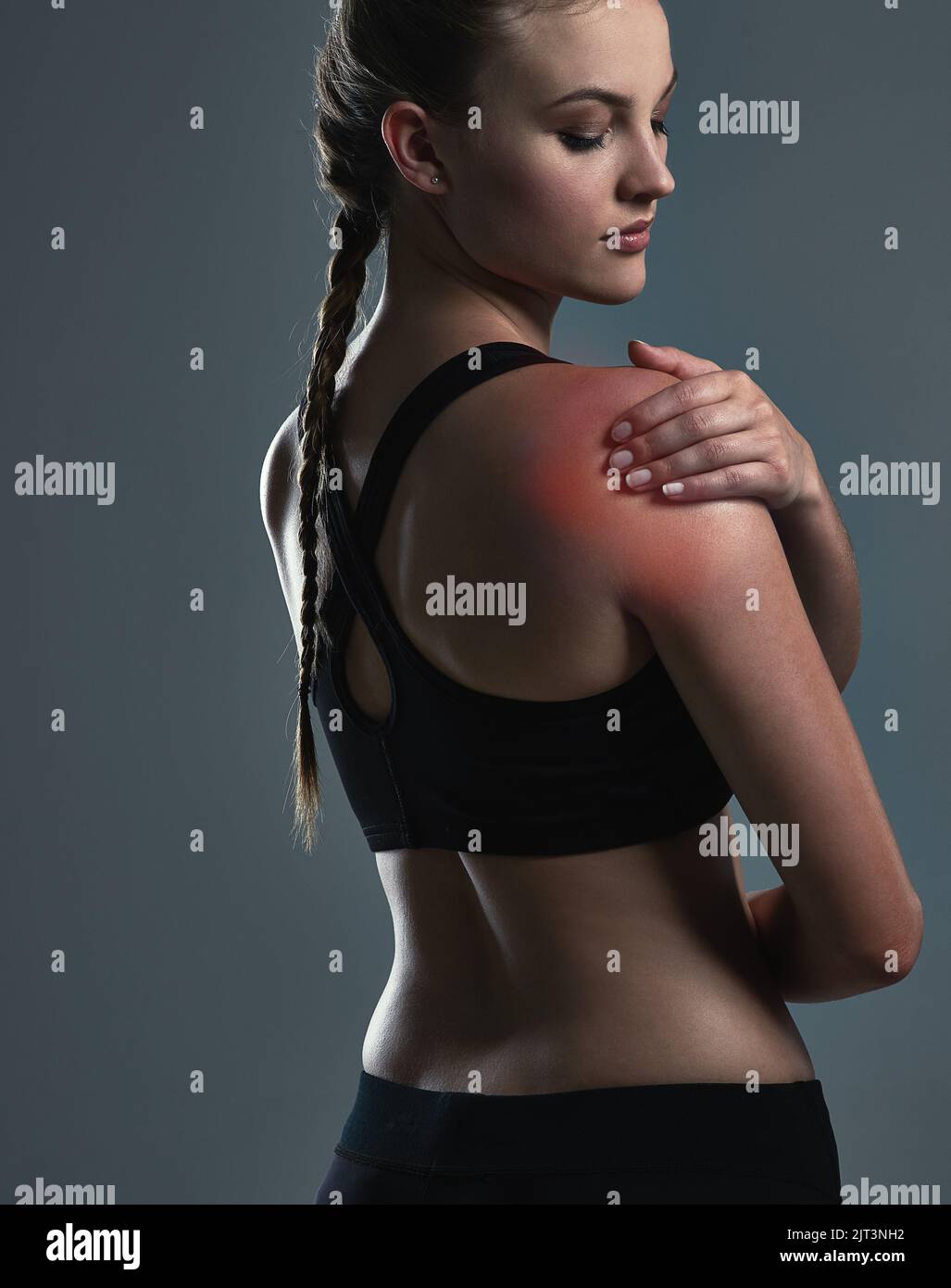 Workout injuries can happen to anyone. a sporty young woman suffering from a shoulder injury
