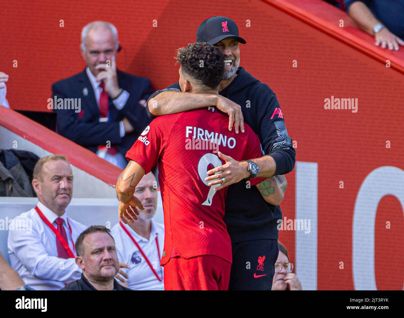 Liverpool. 28th Aug, 2022. Liverpool's manager Jurgen Klopp (R) embraces goal-scorer Roberto Firmino as he is substituted during the English Premier League match between Liverpool and AFC Bournemouth in Liverpool, Britain, on Aug. 27, 2022. Credit: Xinhua/Alamy Live News Stock Photo