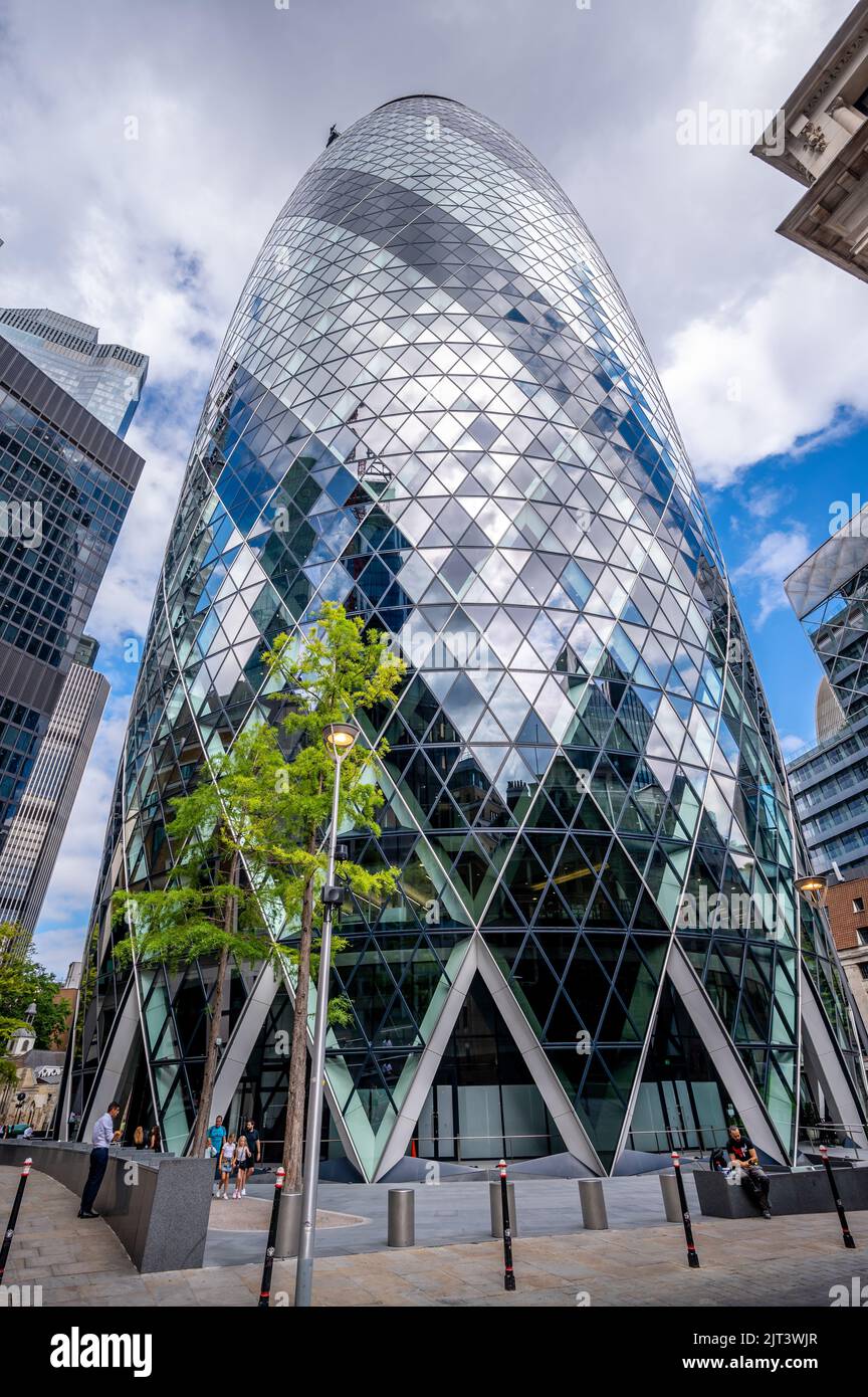 London, UK - August 25, 2022: Skyscraper at 30 St Mary Axe, also known as the Gherkin, and is an Iconic building in the City of London business distri Stock Photo