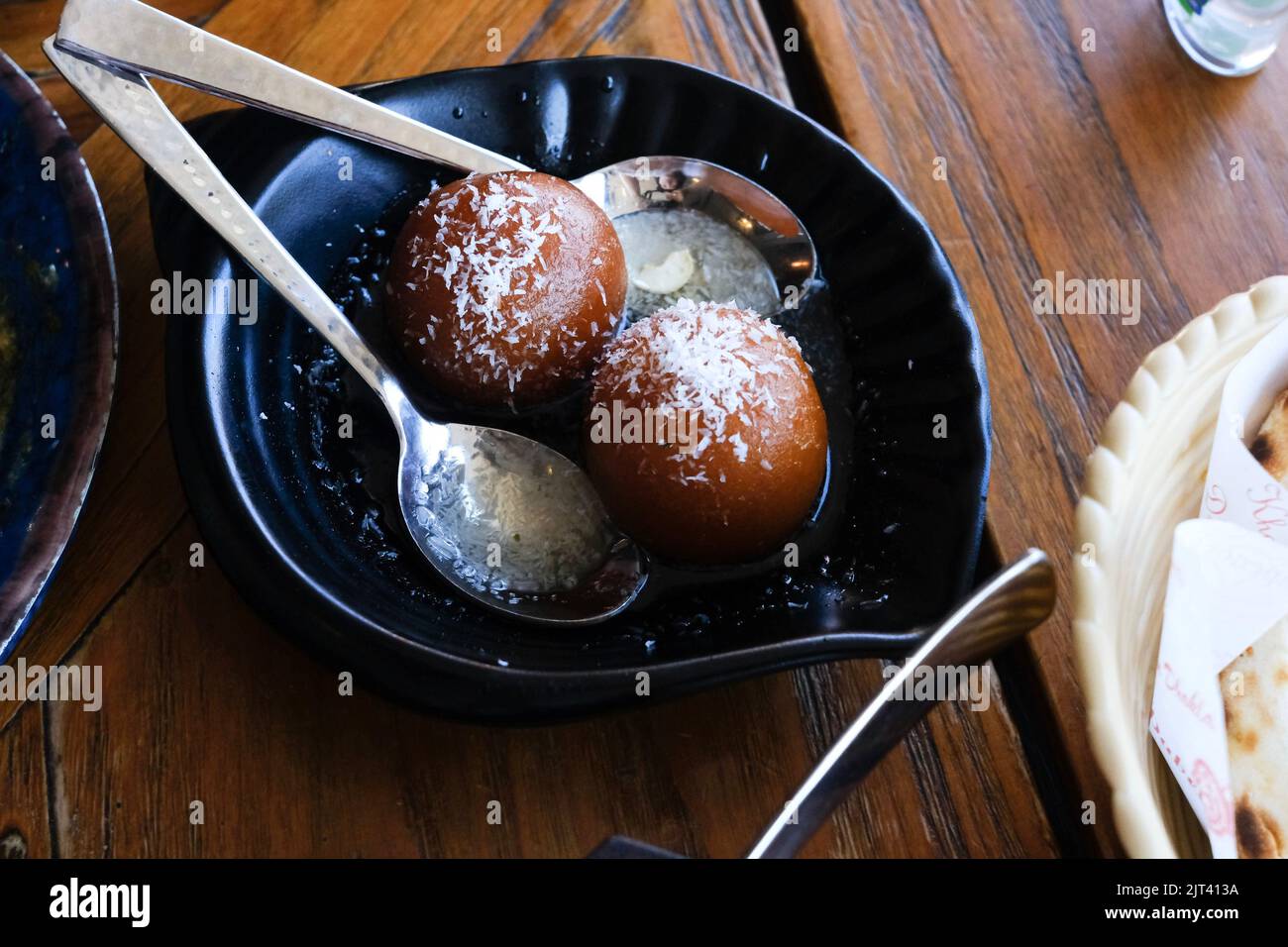 A plate of gulab jamun (Indian sweets) at Chatkazz, a Mumbai-style street food restaurant in Harris Park — Sydney, Australia Stock Photo