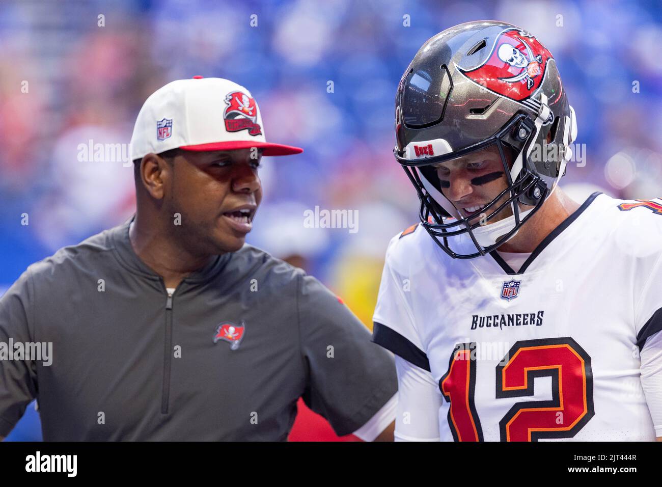 Indianapolis, Indiana, USA. 27th Aug, 2022. Tampa Bay Buccaneers offensive  coordinator Byron Leftwich talks with Buccaneers quarterback Tom Brady (12)  while walking into the locker room prior to the preseason game between