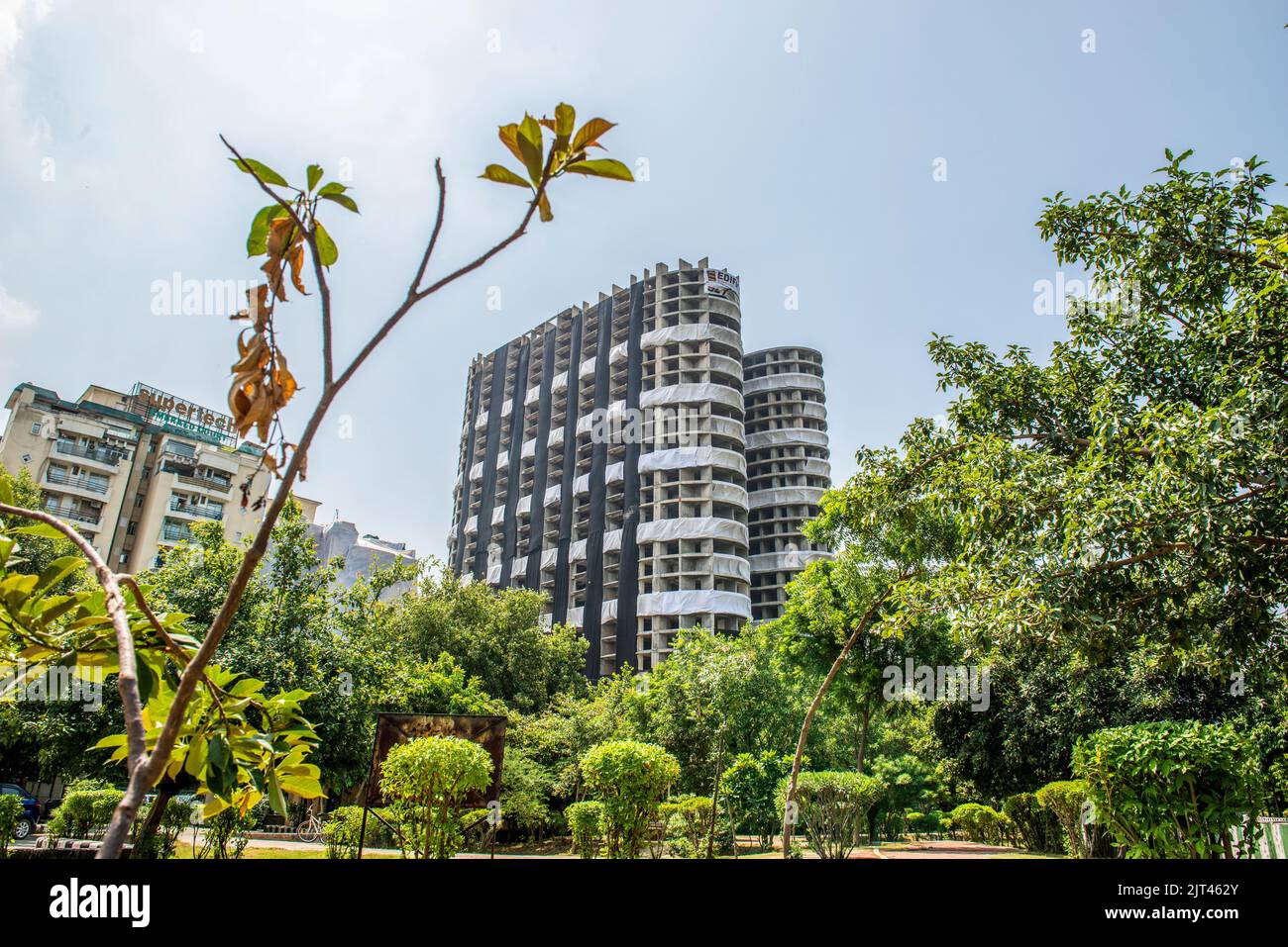 Noida, India. 27th Aug, 2022. Pre demolition work for the Supertech Emerald court project, popularly known as the Supertech twin towers is complete, which are slated for demolition by controlled implosion on August 28 2022. In August 2021 A bench of justices D Y Chandrachud and M R Shah held that the construction of additional towers comprising of around 1,000 flats was in violation of various rules and regulations and directed the company to raze it within three months at its own cost. Credit: SOPA Images Limited/Alamy Live News Stock Photo