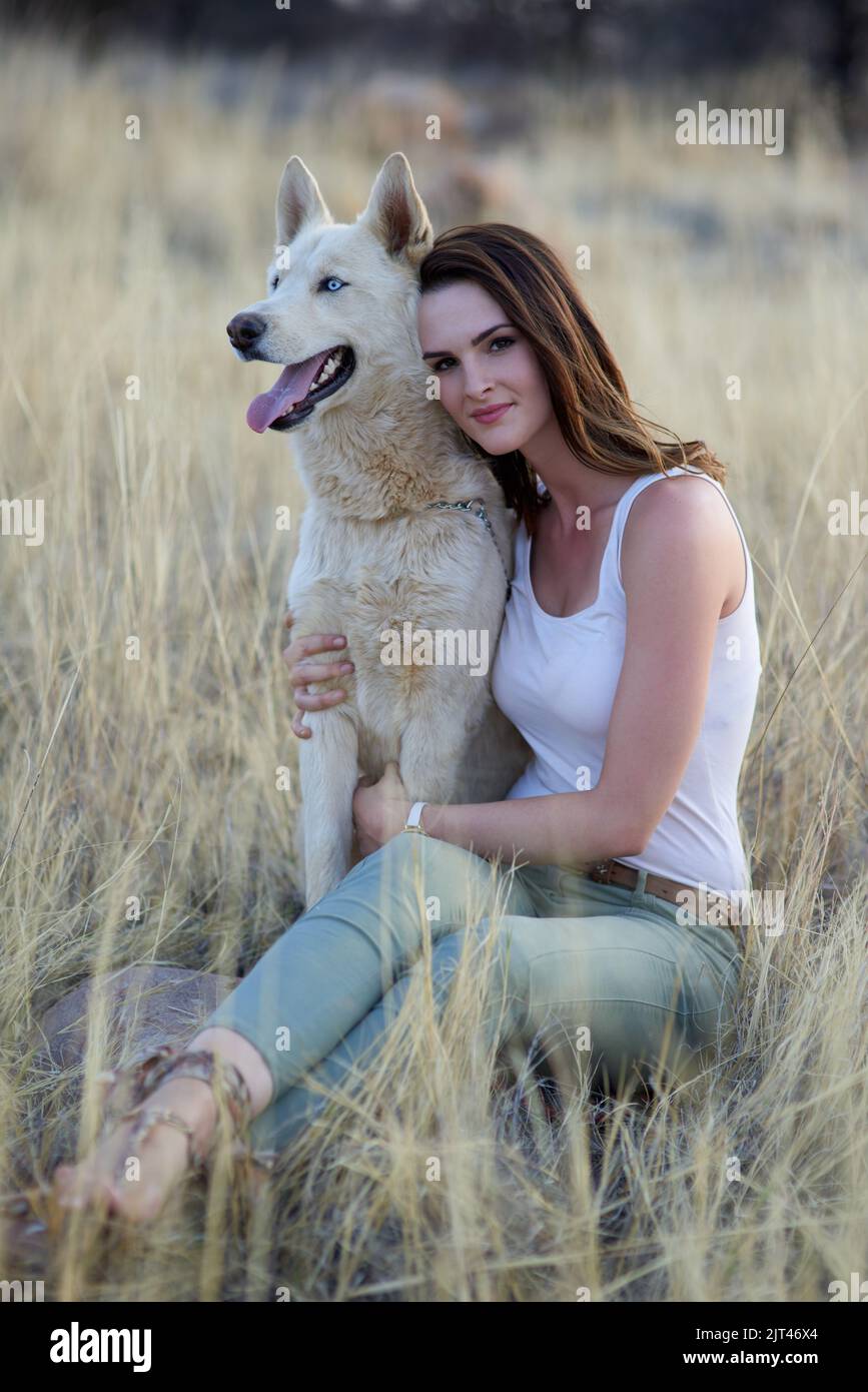 Having a pet is such a pleasure. Portrait of an attractive young woman bonding with her dog outdoors. Stock Photo