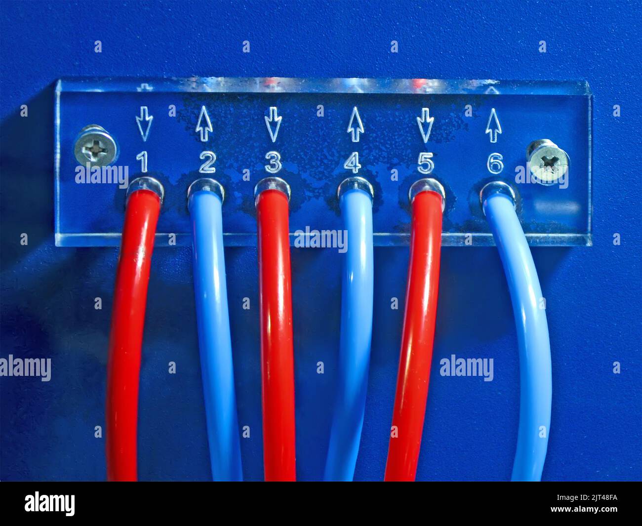 red and blue connected cables pack heap on blue surface. color power