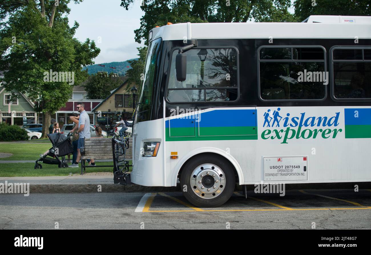 Village Green, Bar Harbor, Maine, USA.  Island Explorer (free) bus waiting for passengers at the village green at the center of Bar Harbor. Stock Photo