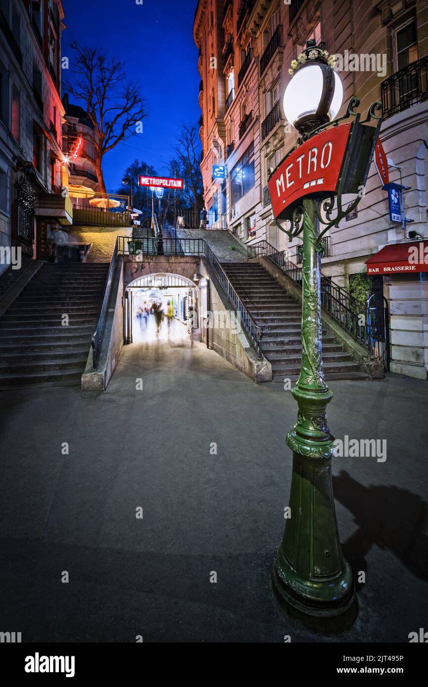France. Paris (75) 18th district. Montmartre district. The stairs of rue Pierre Dac at nightfall. Lamppost of the Lamarck-Caulaincourt metro station w Stock Photo
