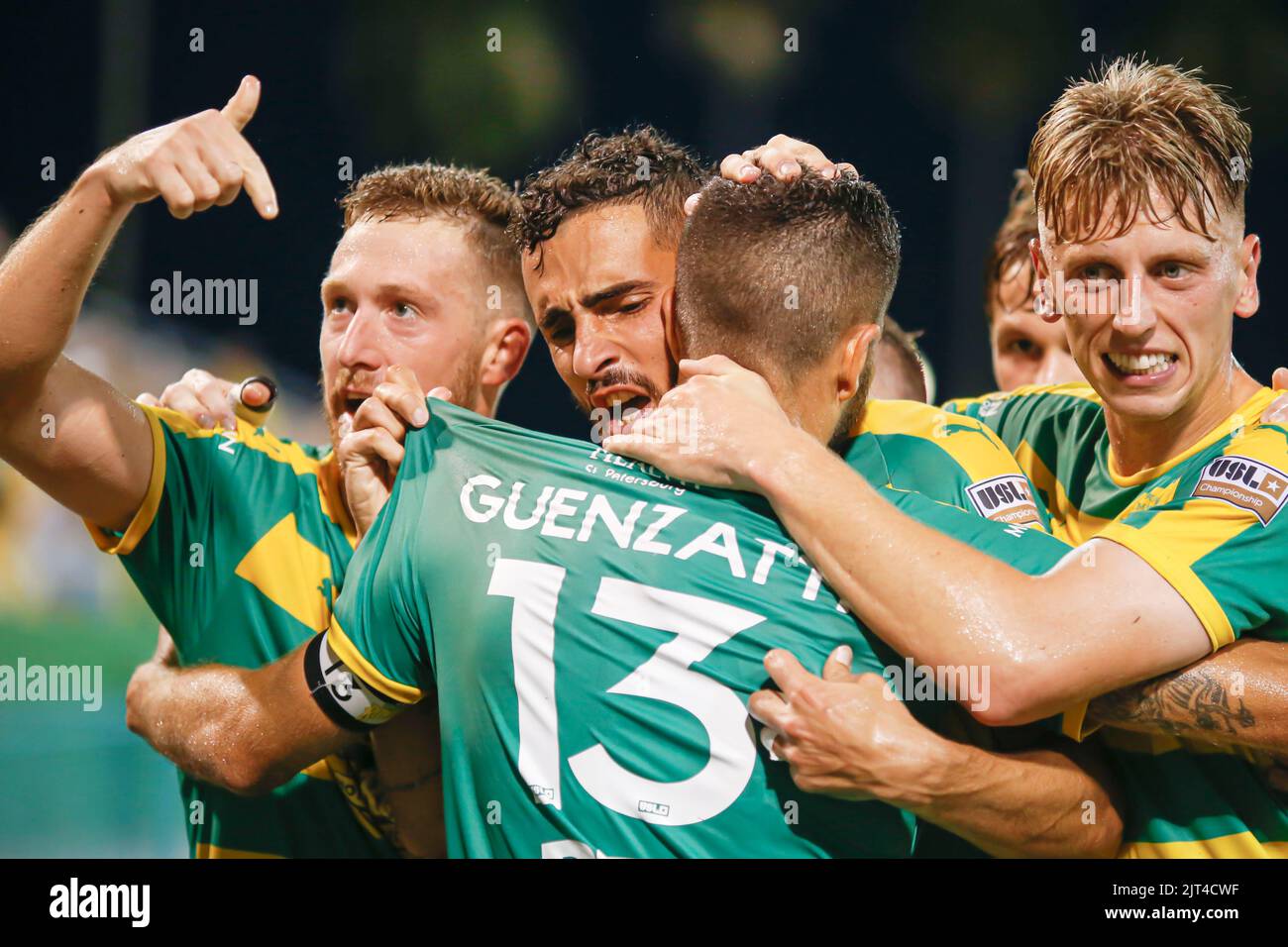 St. Petersburg, FL: Tampa Bay Rowdies forward Sebastián Guenzatti (13) celebrates with midfielders Leo Fernandes (11) and Laurence Wyke (27) and defen Stock Photo