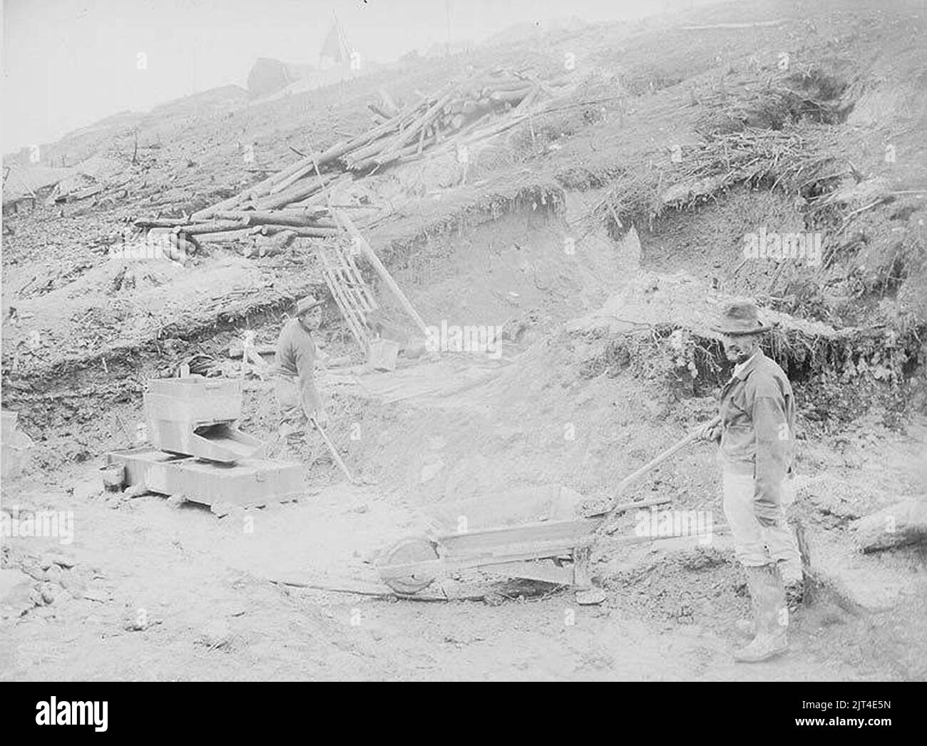 Two men rocking out gold at a mining operation, Gold Hill, Yukon