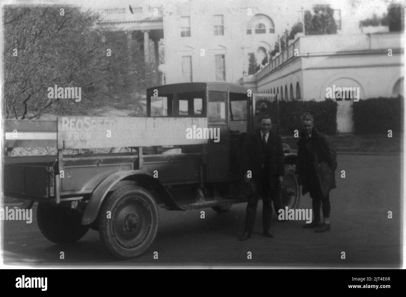 Two men standing next to a Reo truck, which brought Eskimo pie from Chicago to President Harding at the White House Stock Photo