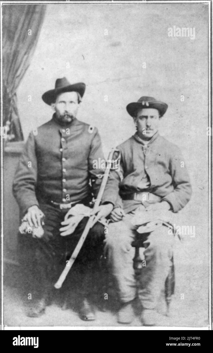 Two unidentified Civil War soldiers in Union uniforms, seated in a ...