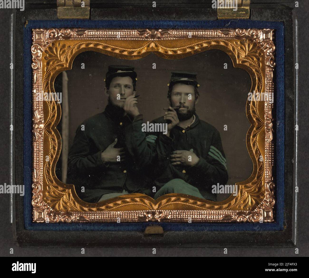 Two unidentified soldiers in Union uniforms holding cigars in each ...
