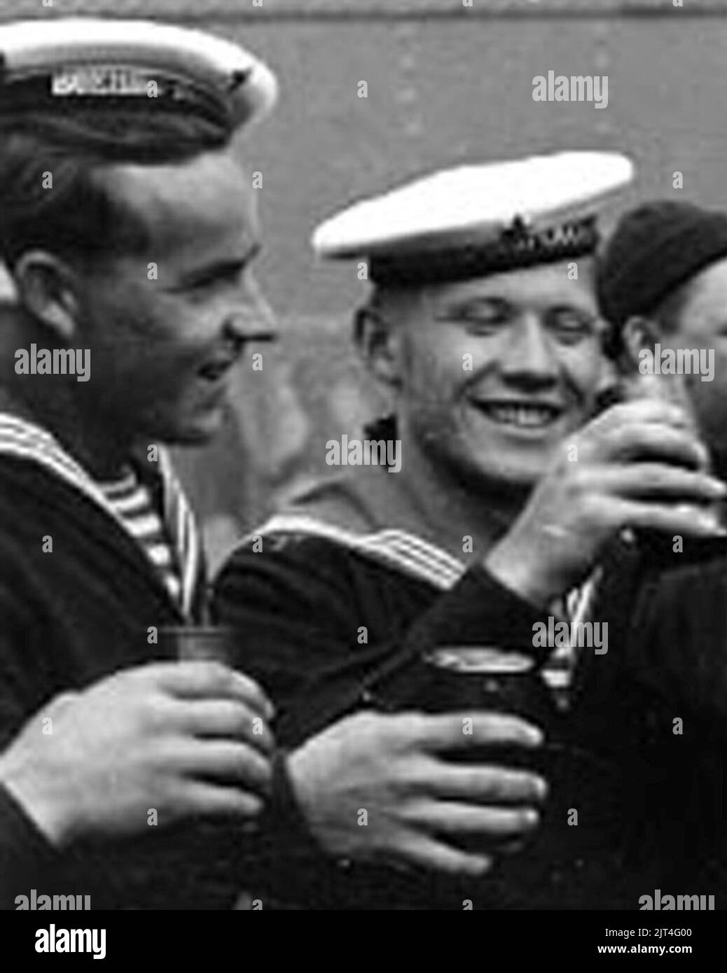 Two USSR sailors drinking beer from ''olive drab color beer cans on 14