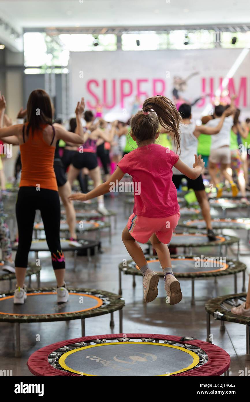 Little Girl having Fun Jumping During Fitness Workout with Rebounders