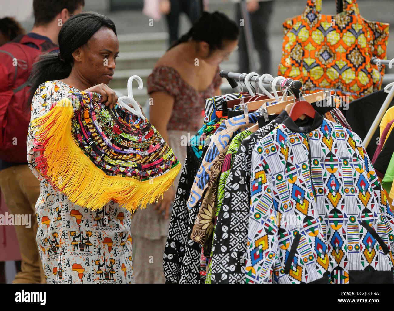 Vancouver, Canada. 27th Aug, 2022. A vendor arranges clothes during the Black Block Party, an event organized by local black community, in Vancouver, British Columbia, Canada, on Aug. 27, 2022. Credit: Liang Sen/Xinhua/Alamy Live News Stock Photo