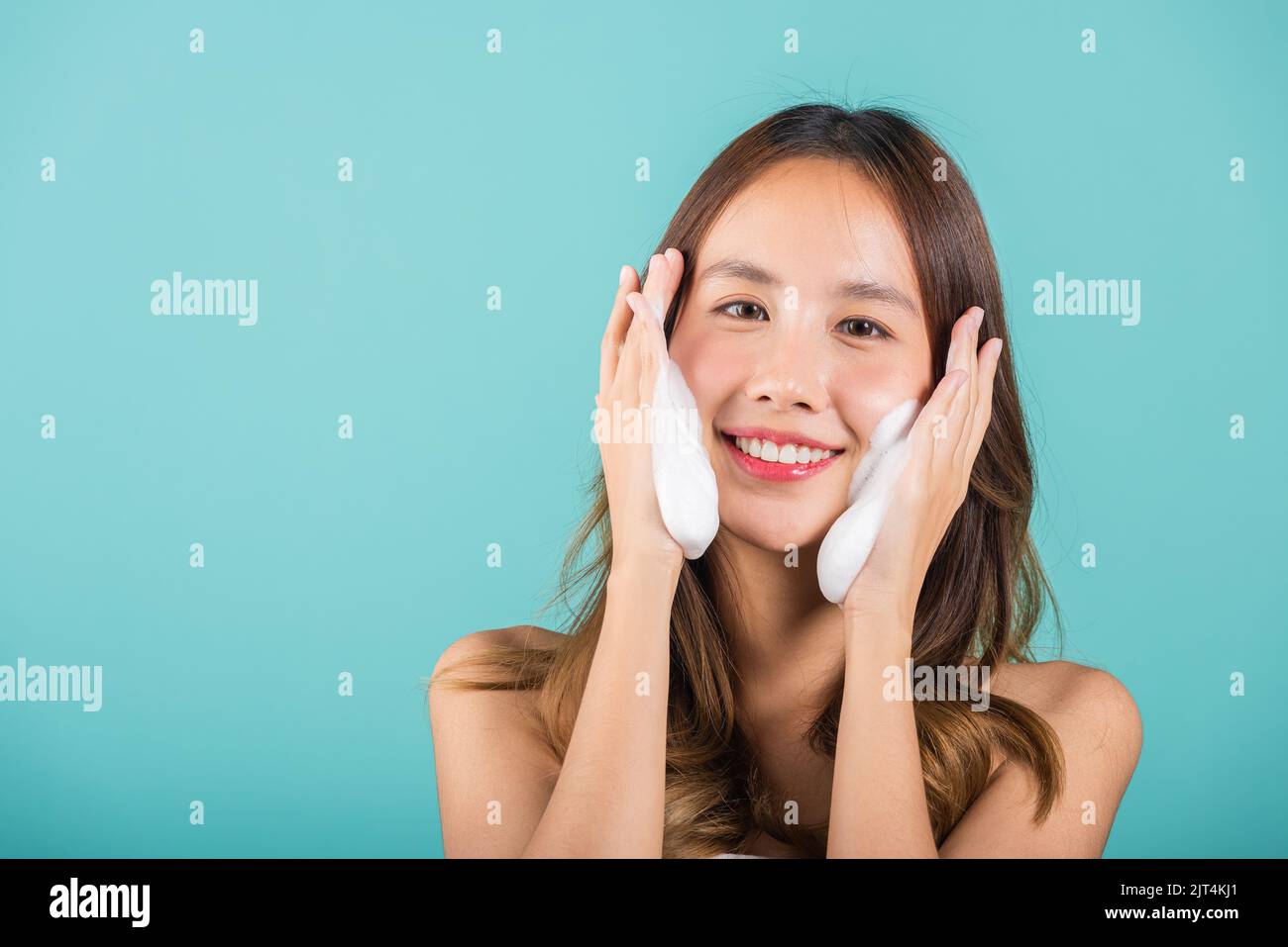 Asian woman face wash exfoliate scrub soap foam with skincare cleansing