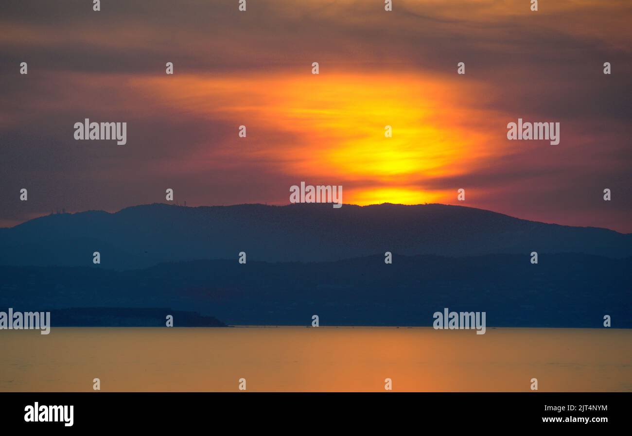 Sunset on lake in summer in Italy Stock Photo