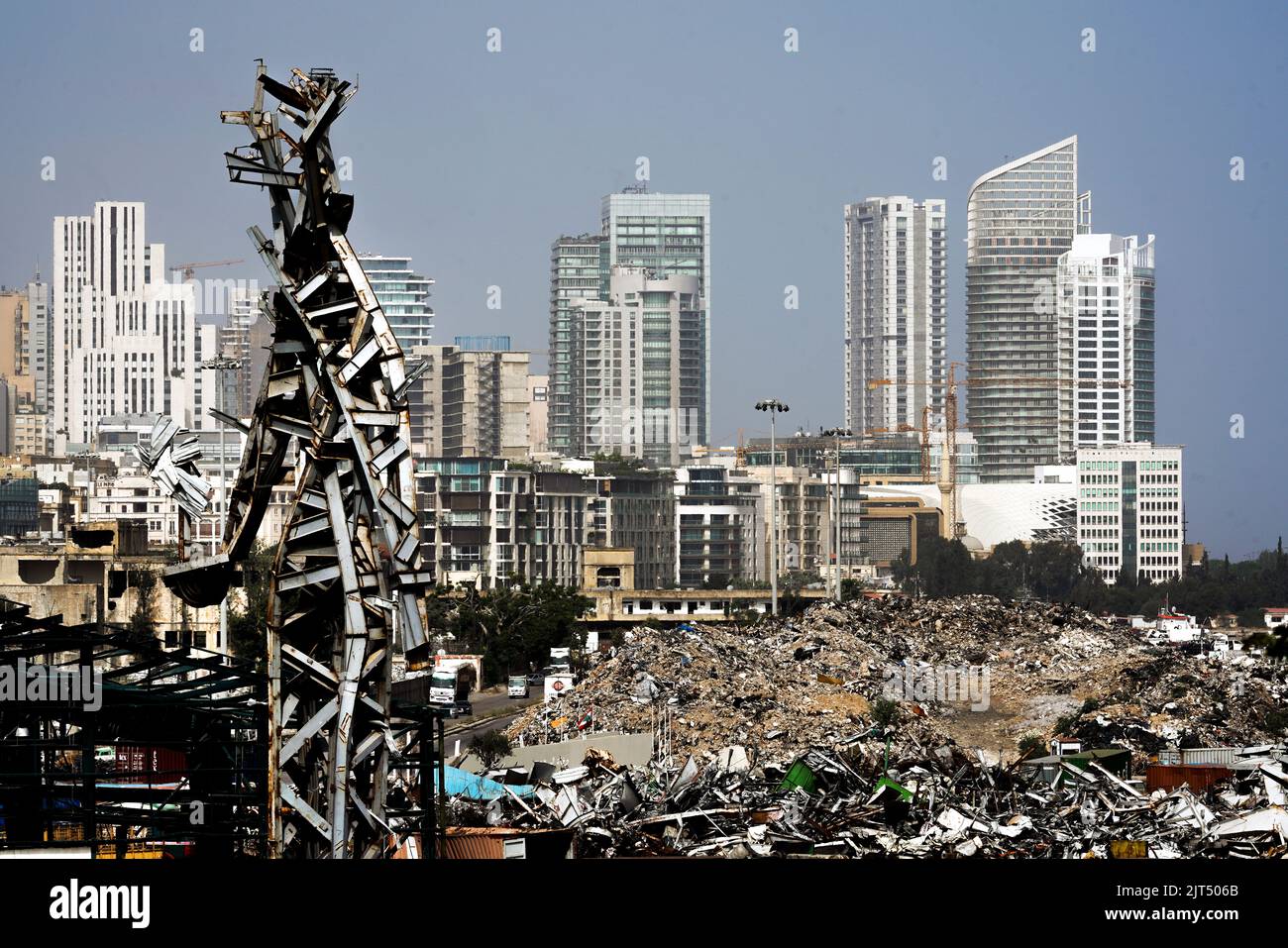 Beirut, Lebanon: Against the modern city's skyline stands artist Nadim Karam's steel sculpture commemorating the victims of the deadly 8/4/2020 explosion, made from the scrap metal from the massive explosion of 2,750 tons of ammonium nitrate stored in the port. Stock Photo