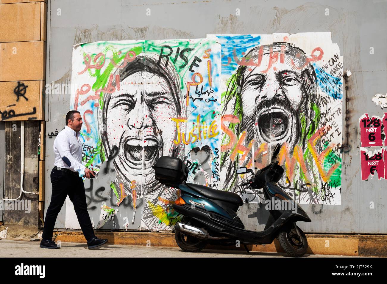Beirut, Lebanon: A wall is painted with graffiti of screaming people at Martyrs' Square in downtown Beirut Stock Photo