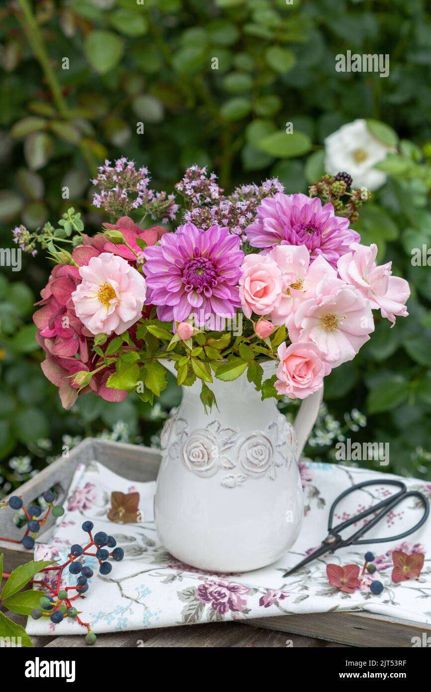 bouquet of pink dahlias, roses, hydrangea flowers and wild thyme flowers Stock Photo