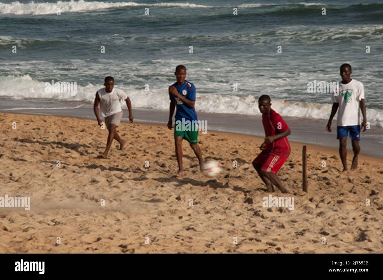 Footballers beside The Atlantic, Sinkor, Monrovia, Liberia Stock Photo