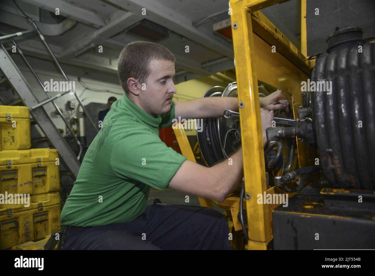 U.S. Navy Aviation Support Equipment Technician 2nd Class repairs the