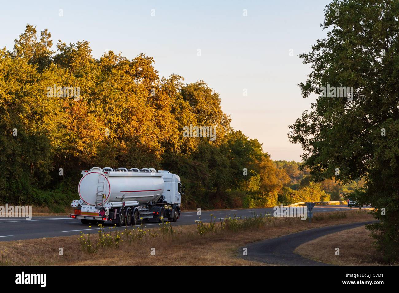 Fuel tanker truck driving along a conventional highway Stock Photo Alamy