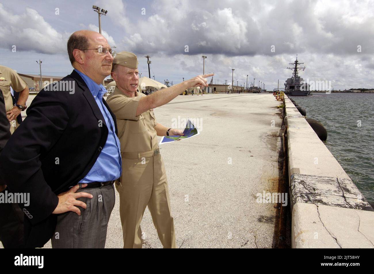 U.S. Navy Rear Adm. Charles Leidig, right, gives Dr. Donald C. Winter a tour of Naval Base Guam 060825 Stock Photo