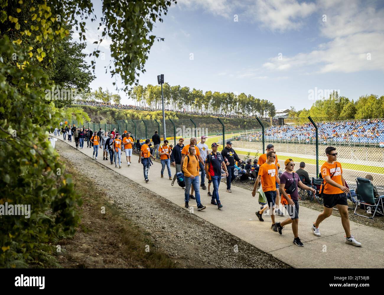 SPA - Fans of Max Verstappen walk on the track leading up to the F1 Grand Prix of Belgium at the Spa-Francorchamps circuit on August 29, 2022 in Spa, Belgium. REMKO DE WAAL Stock Photo