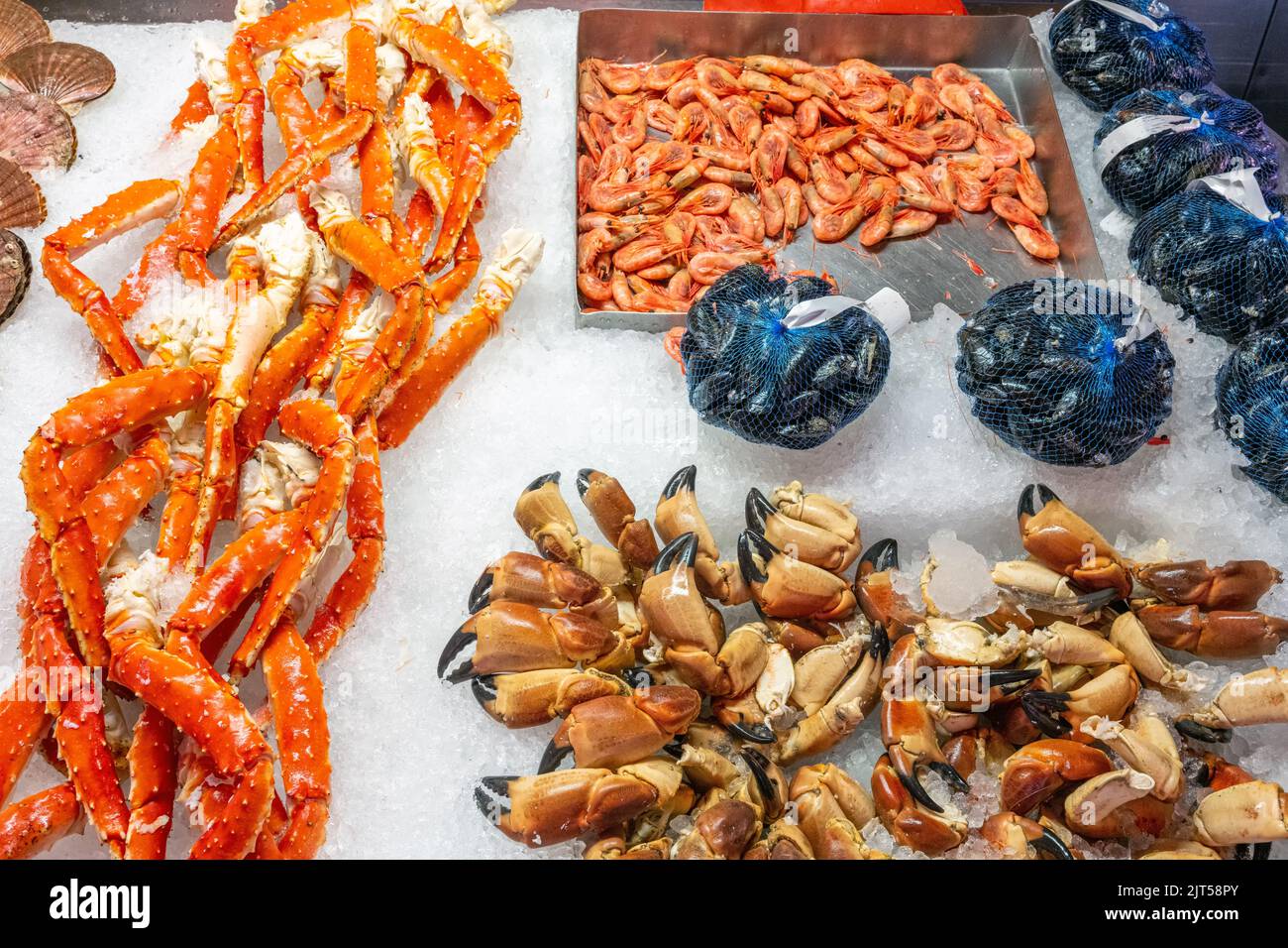Prawns, clams and crabs for sale at a market in Bergen, Norway Stock Photo