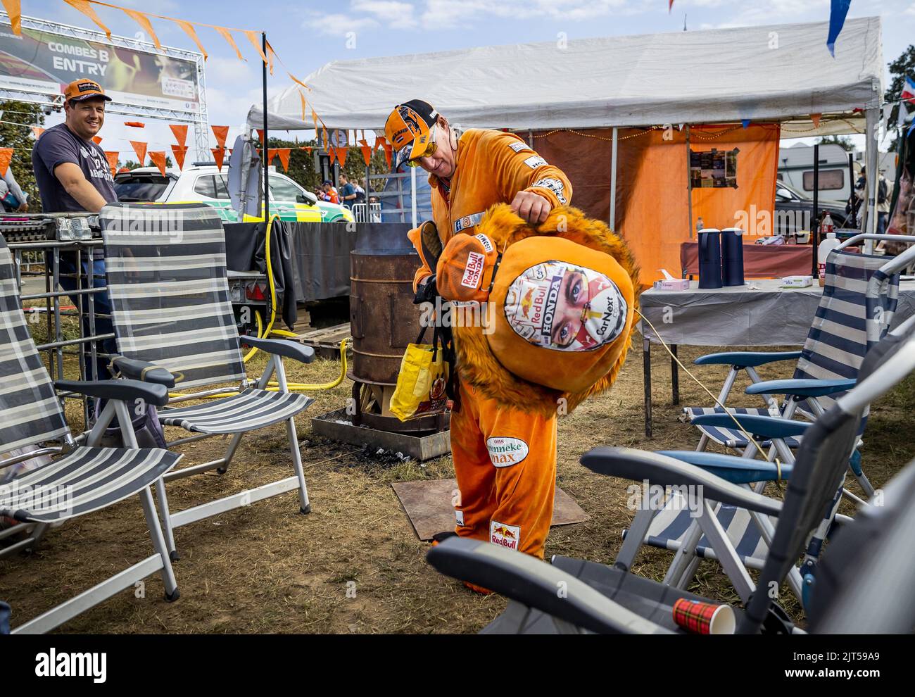 SPA - A fan of Max Verstappen prepares at the campsite leading up to the F1 Grand Prix of Belgium at the Spa-Francorchamps circuit on August 29, 2022 in Spa, Belgium. REMKO DE WAAL Stock Photo