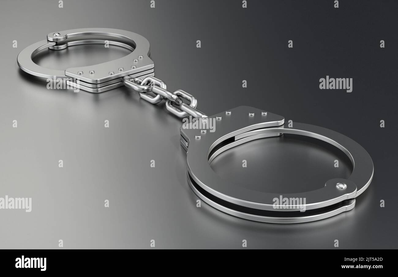 Handcuffs standing on gray background. 3D illustration. Stock Photo