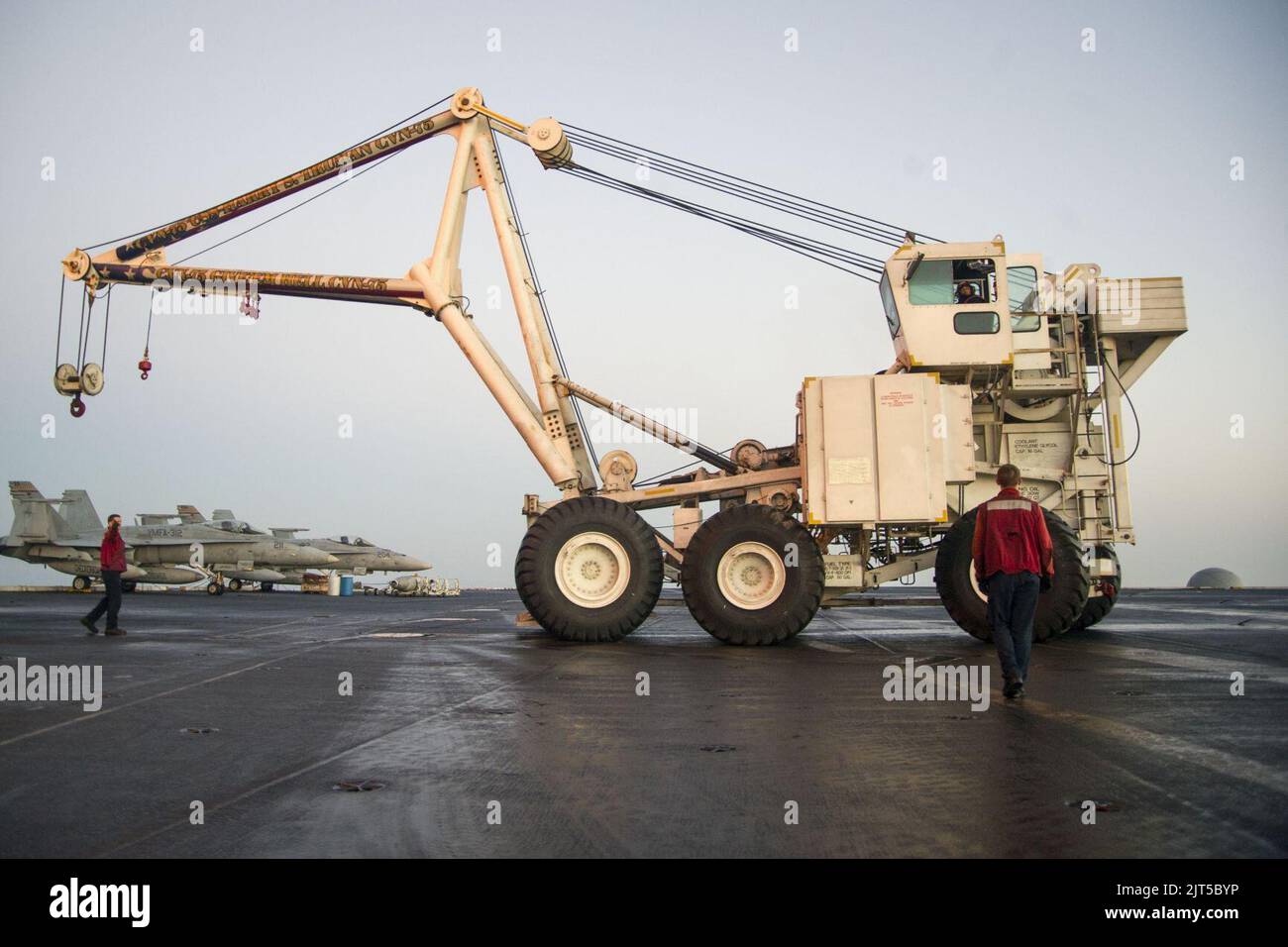 U.S. Sailors assigned to the crash and salvage team aboard the aircraft ...