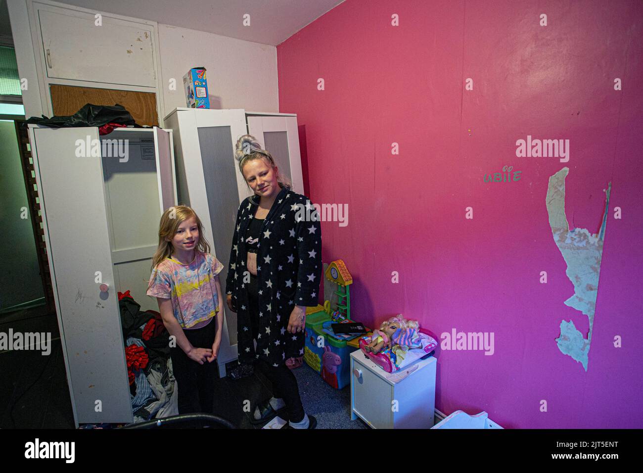 Mother with daughter in their flat at the The Forest Estate ,Lewisham, London, England . Stock Photo